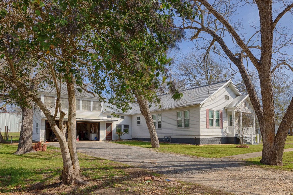 309 Anderson Street Schulenburg, TX 78956 - Photo 2 of 19 a front view of a house with a yard