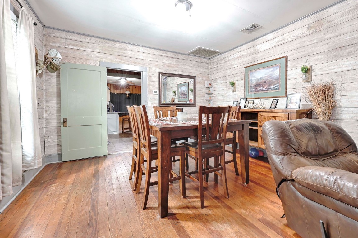 309 Anderson Street Schulenburg, TX 78956 - Photo 6 of 19 a view of a dining room with furniture window and wooden floor