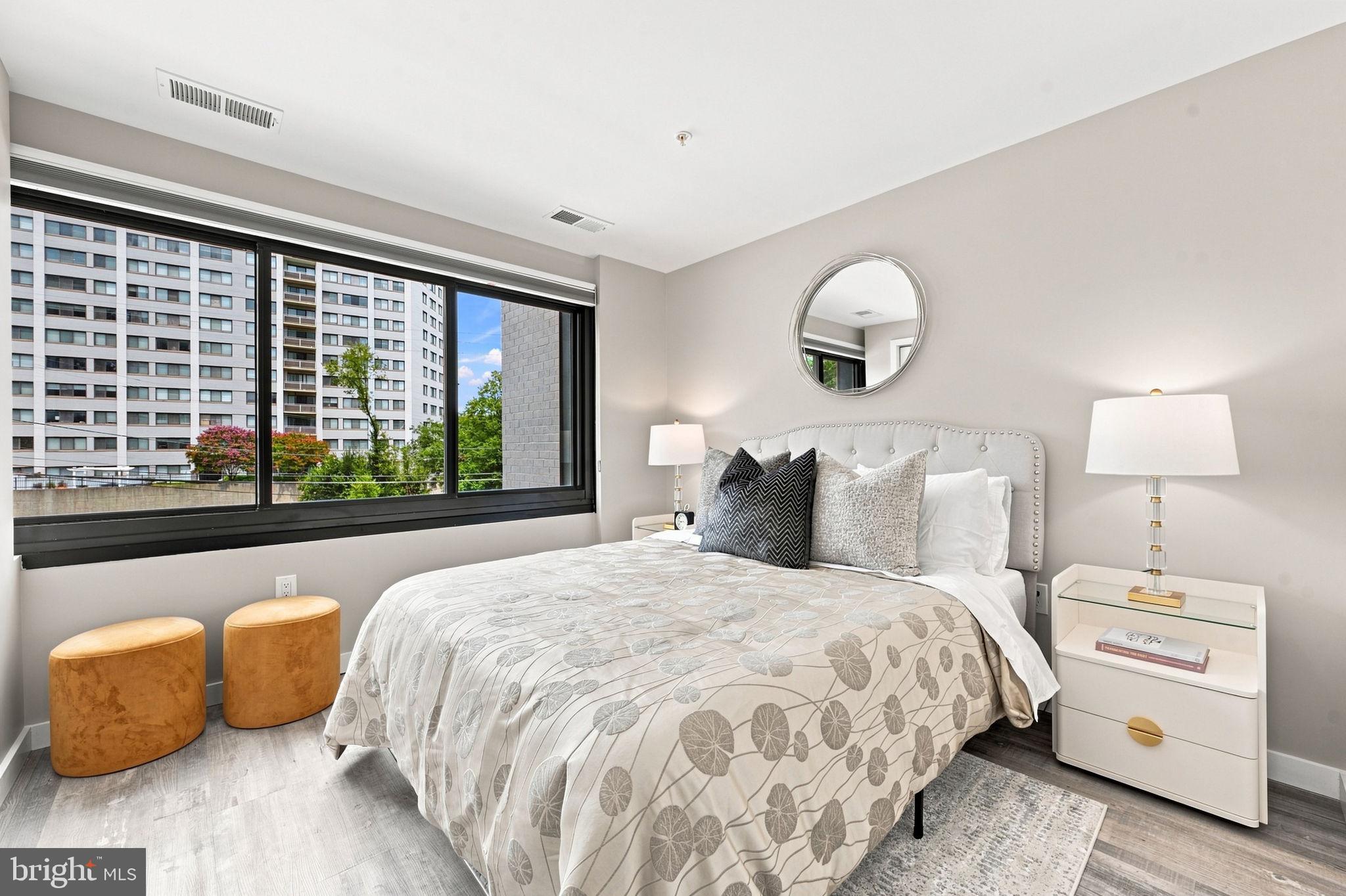 700 Roeder Road, Unit 203 Silver Spring, MD 20910 - Photo 13 of 37 Modern bedroom with city views.