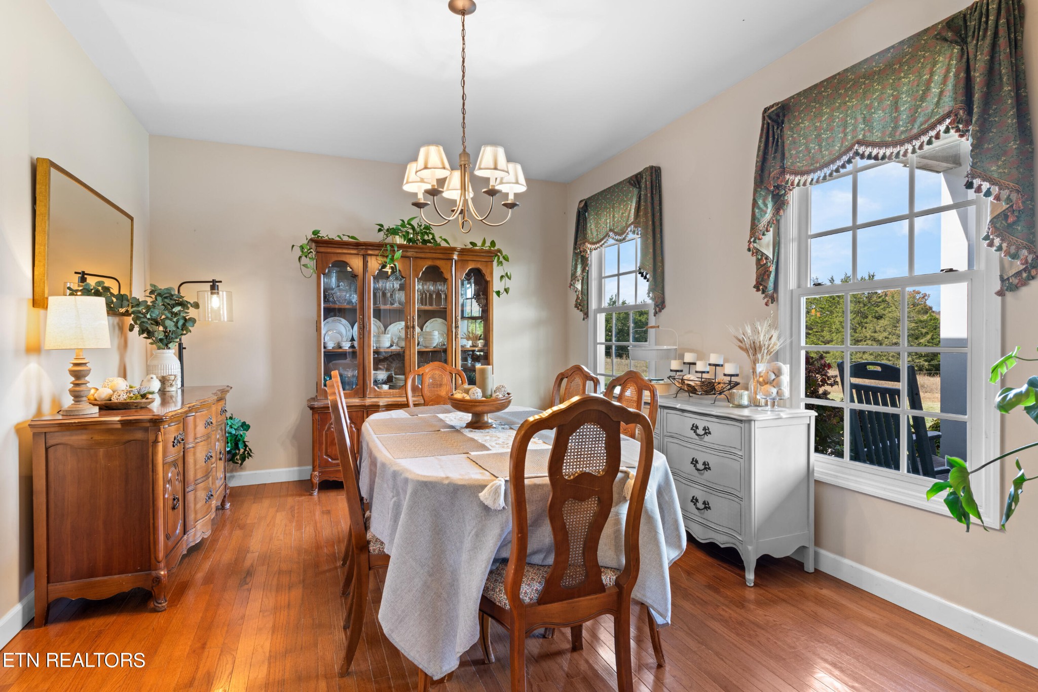 1443 West Dumplin Valley Road Dandridge, TN 37725 - Photo 14 of 51 a view of a dining room with furniture wooden floor and chandelier