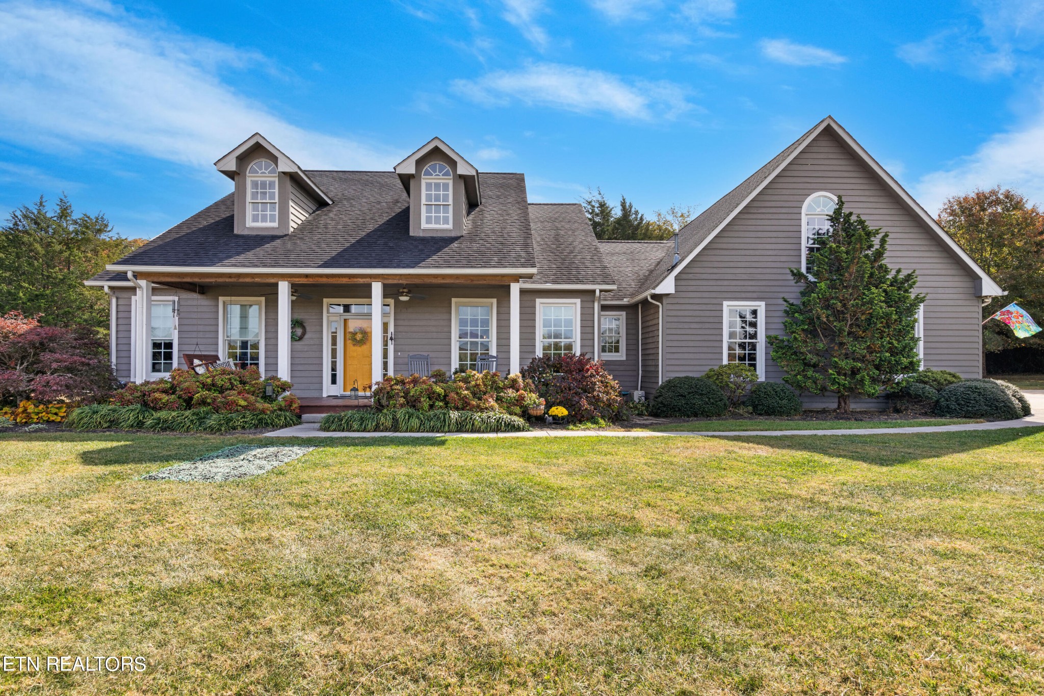1443 West Dumplin Valley Road Dandridge, TN 37725 - Photo 2 of 51 a front view of a house with garden