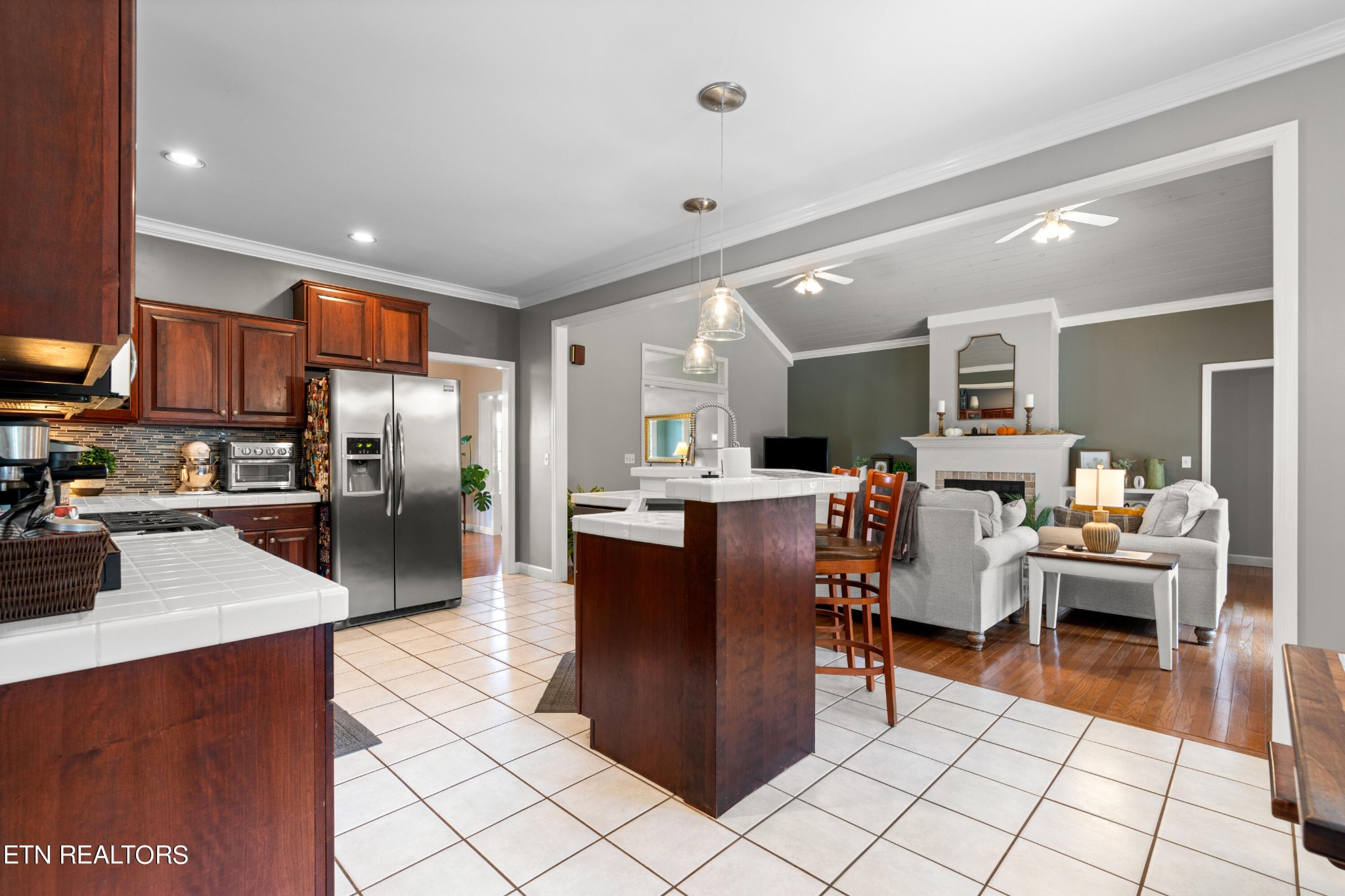 1443 West Dumplin Valley Road Dandridge, TN 37725 - Photo 21 of 51 a kitchen with stainless steel appliances kitchen island granite countertop a refrigerator and a sink
