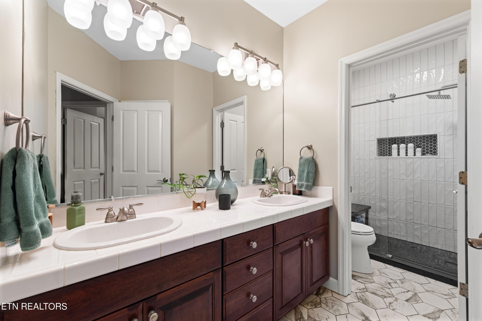 1443 West Dumplin Valley Road Dandridge, TN 37725 - Photo 35 of 51 a bathroom with a double vanity sink mirror and toilet