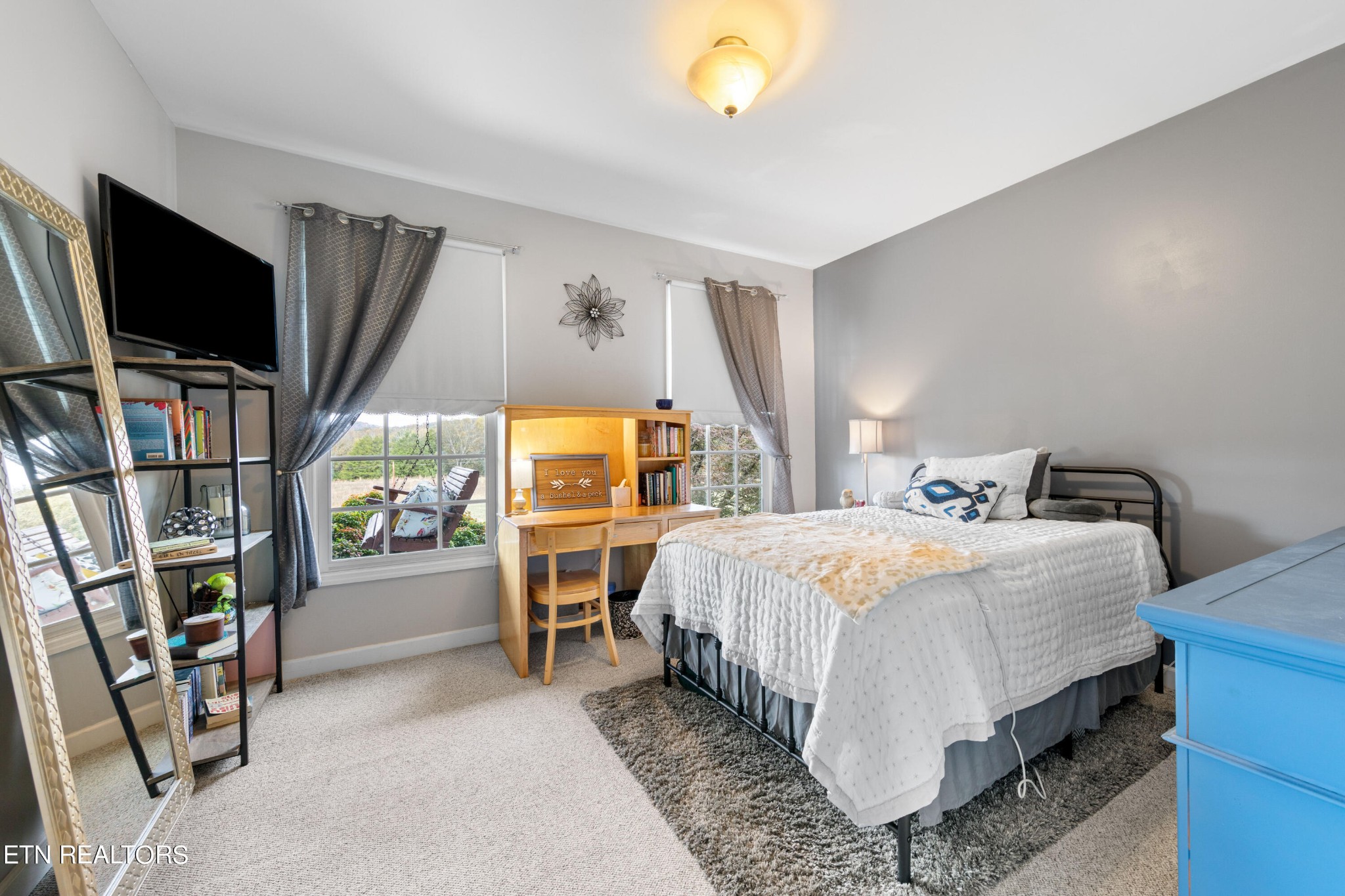 1443 West Dumplin Valley Road Dandridge, TN 37725 - Photo 37 of 51 a bedroom with a bed and flat screen tv
