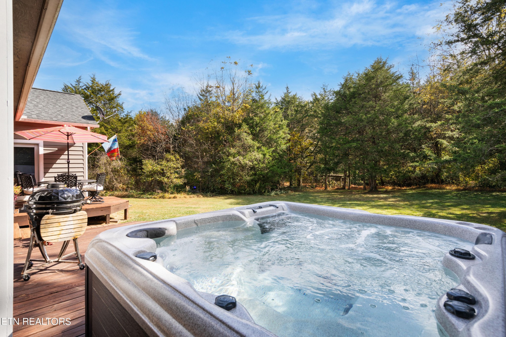 1443 West Dumplin Valley Road Dandridge, TN 37725 - Photo 42 of 51 a view of a swimming pool with an outdoor space and seating area