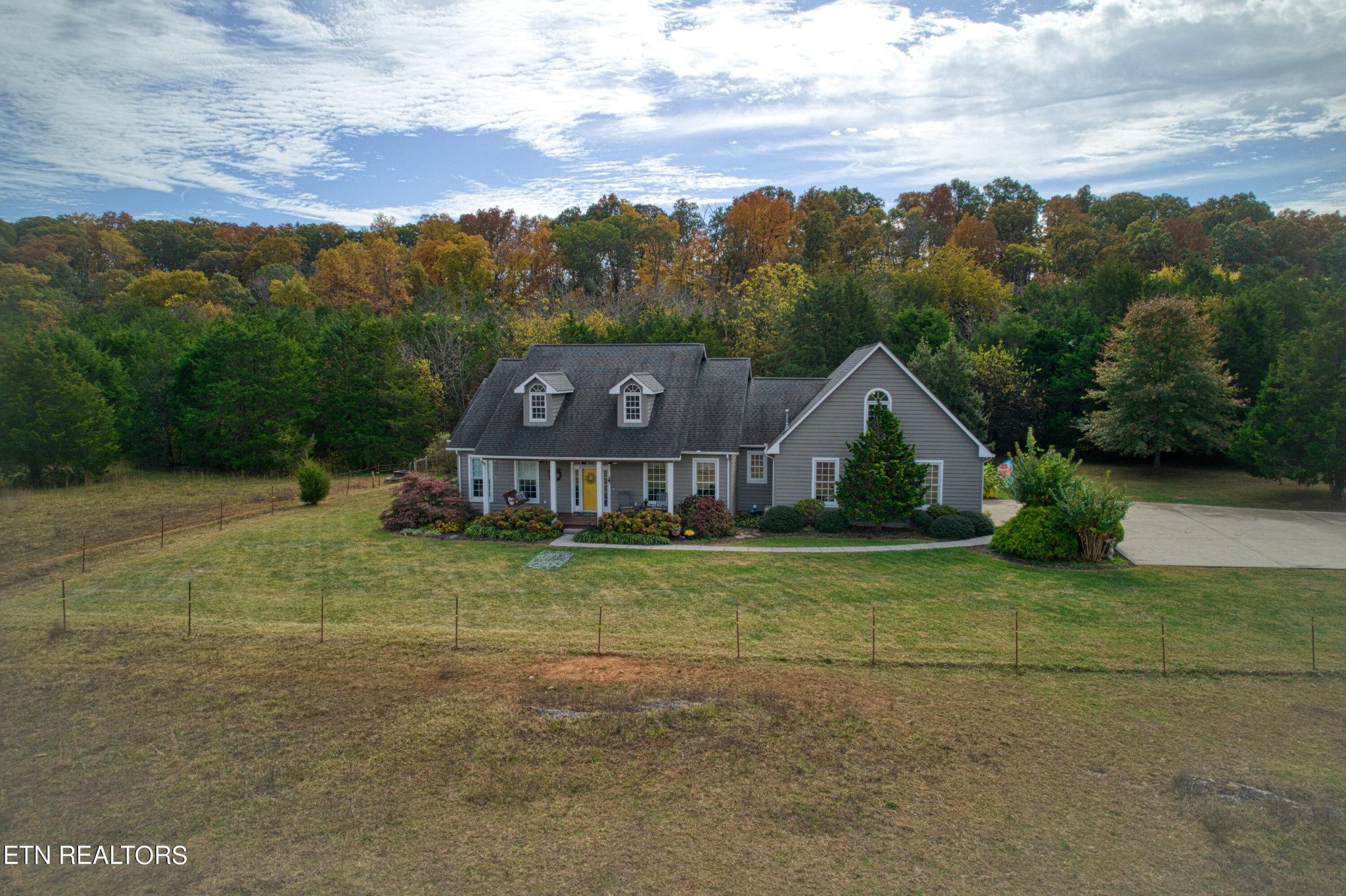1443 West Dumplin Valley Road Dandridge, TN 37725 - Photo 7 of 51 a house with trees in the background