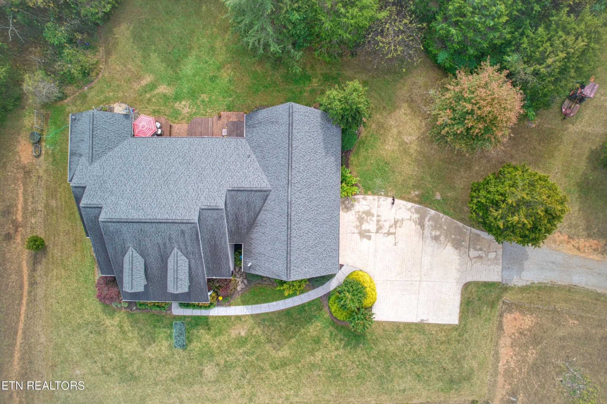 1443 West Dumplin Valley Road Dandridge, TN 37725 - Photo 10 of 51 an aerial view of a house with outdoor space and a lake view in back