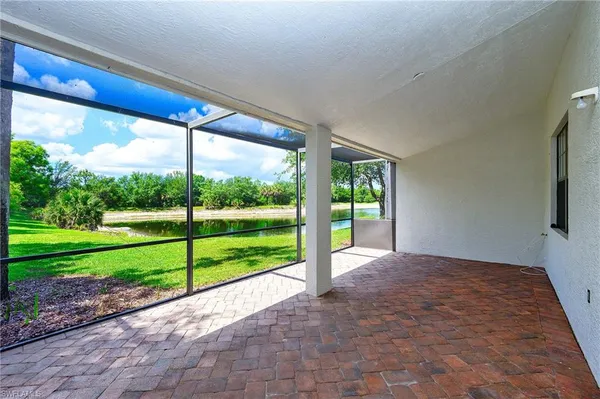 a view of a room with porch and wooden floor