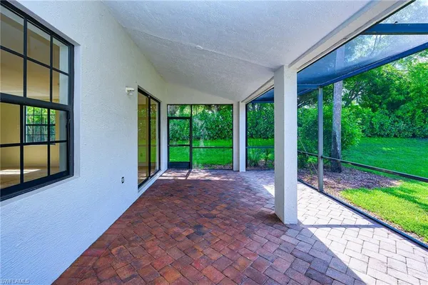 a view of porch with a floor to ceiling window and garden
