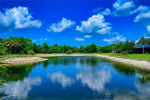 a view of lake with green space