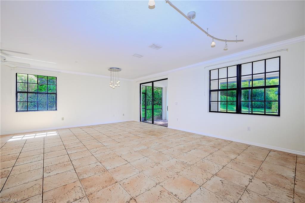 15056 Summit Pl Circle, Unit 228 Naples, FL 34119 - Photo 8 of 27 a view of an empty room with a window