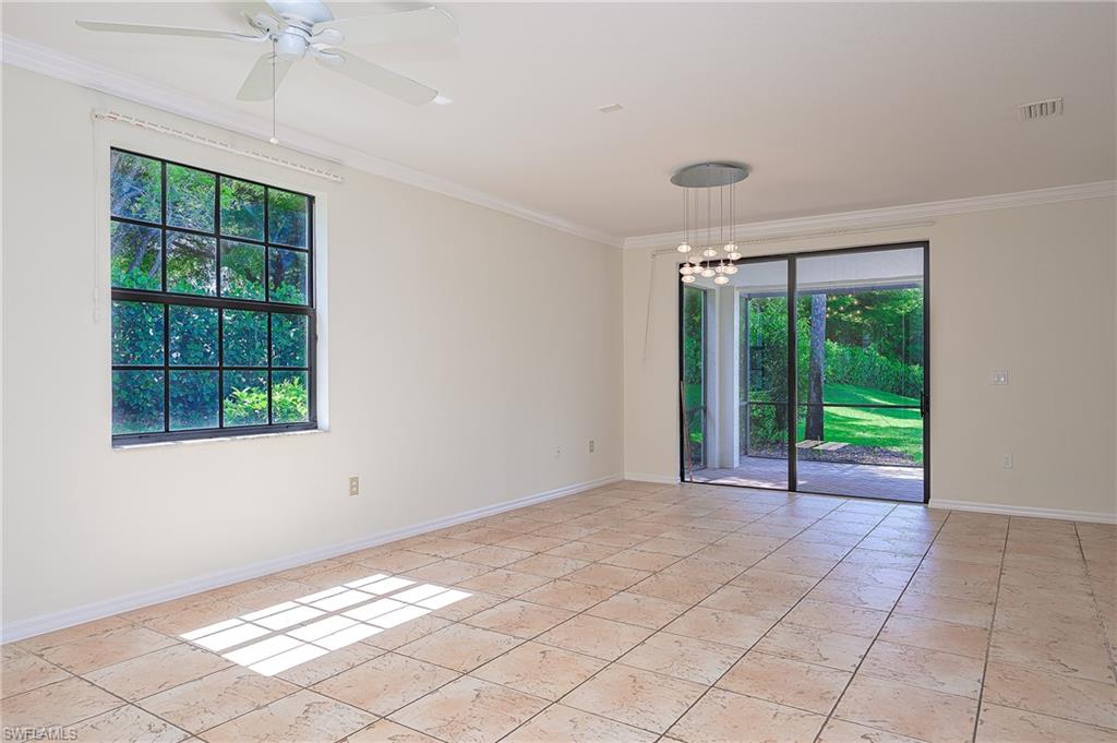 15056 Summit Pl Circle, Unit 228 Naples, FL 34119 - Photo 9 of 27 a view of an empty room with a window