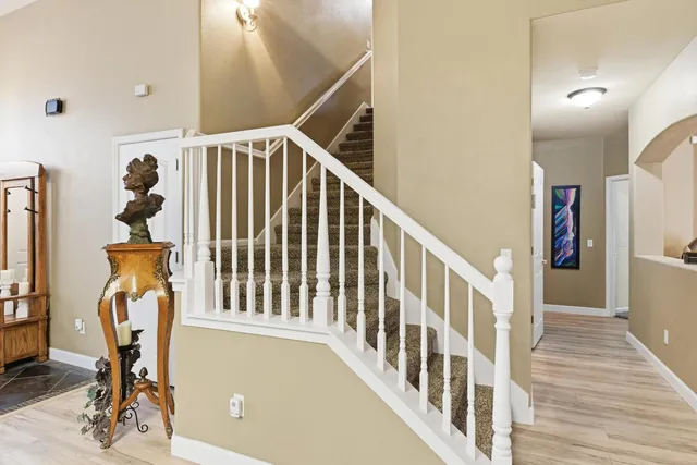 a view of an entryway with wooden floor