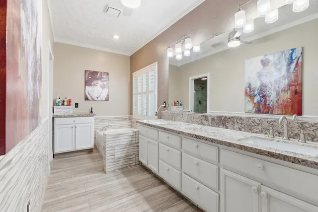 a bathroom with a double vanity sink mirror and double