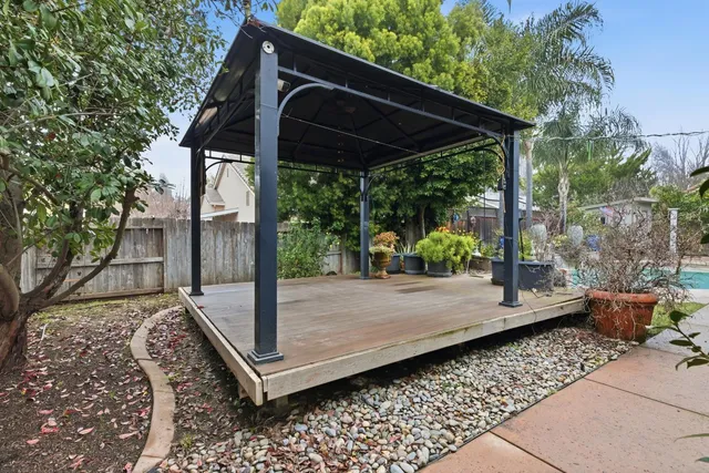 a view of a wooden door with a backyard