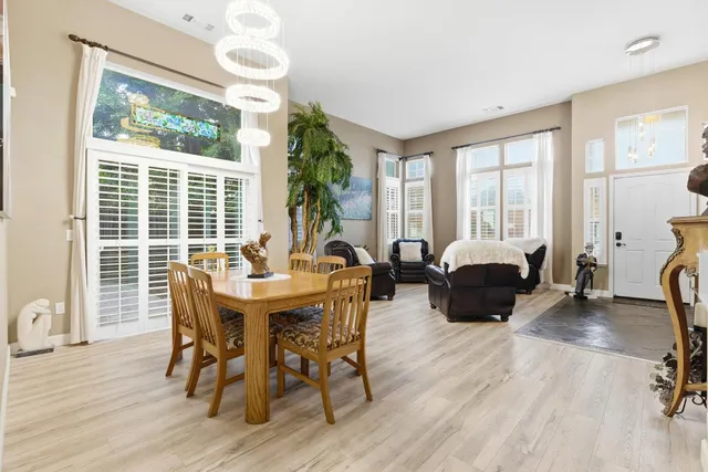 a view of a dining room with furniture window and outside view