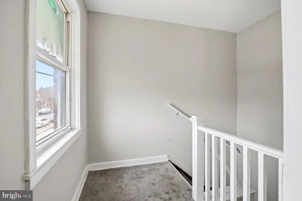 a view of hallway with windows