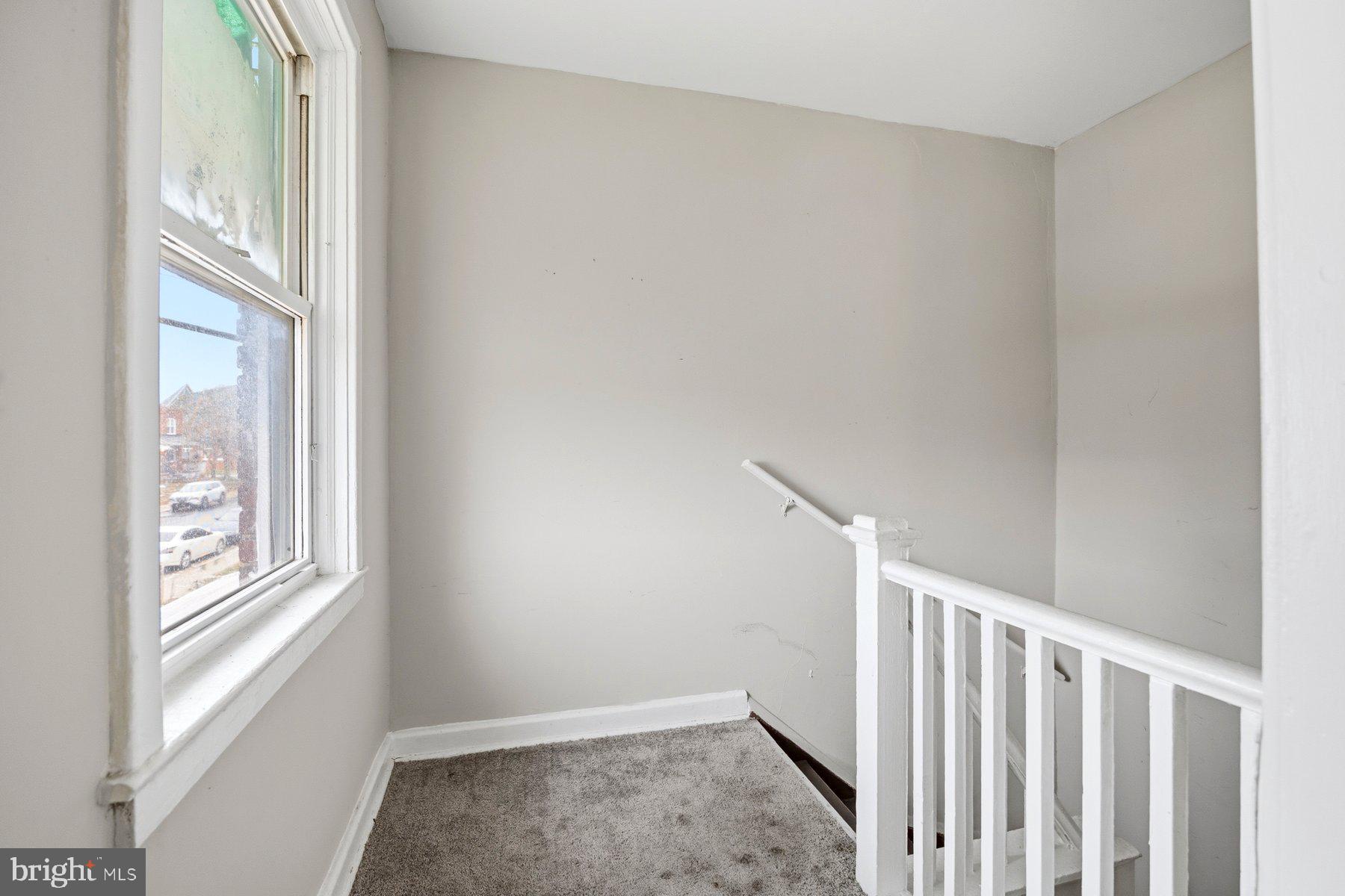923 1st Street Baltimore, MD 21225 - Photo 17 of 32 a view of a hallway with wooden floor and entryway