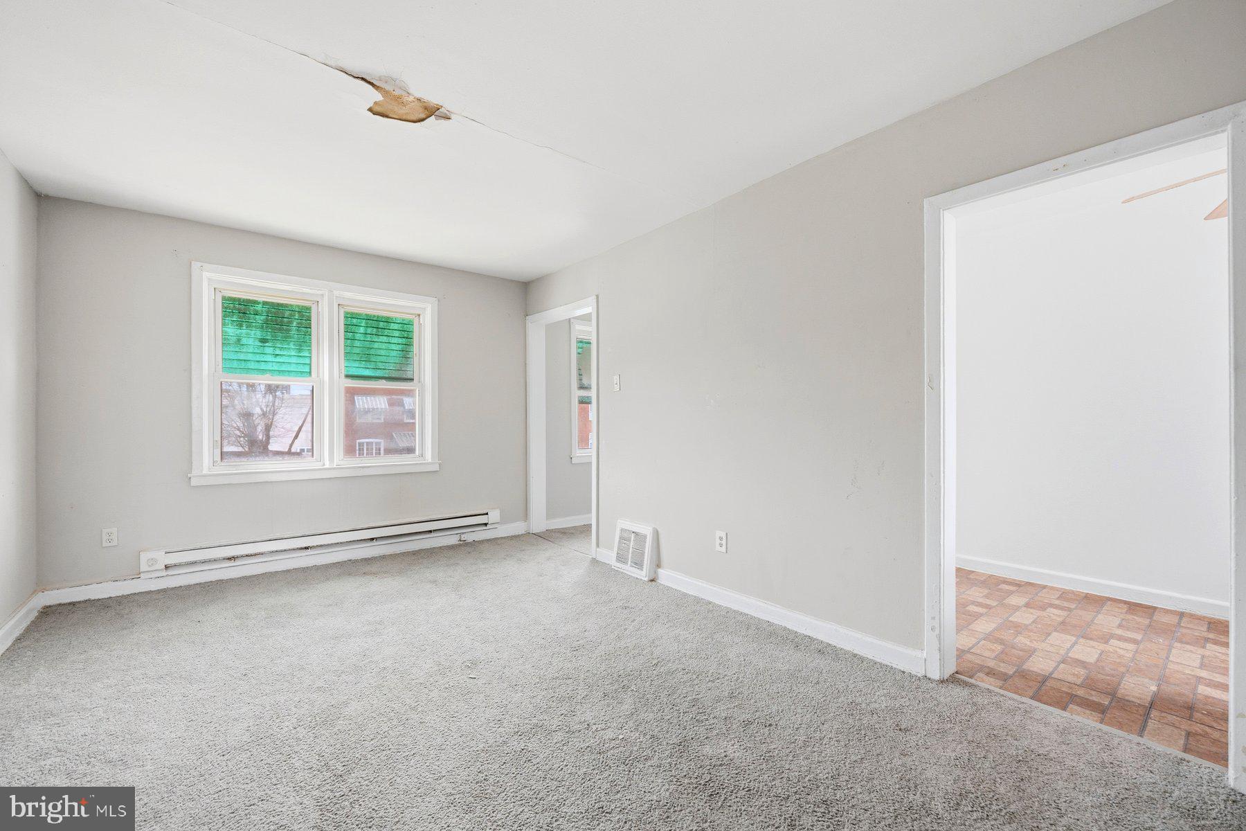 923 1st Street Baltimore, MD 21225 - Photo 20 of 32 an empty room with windows