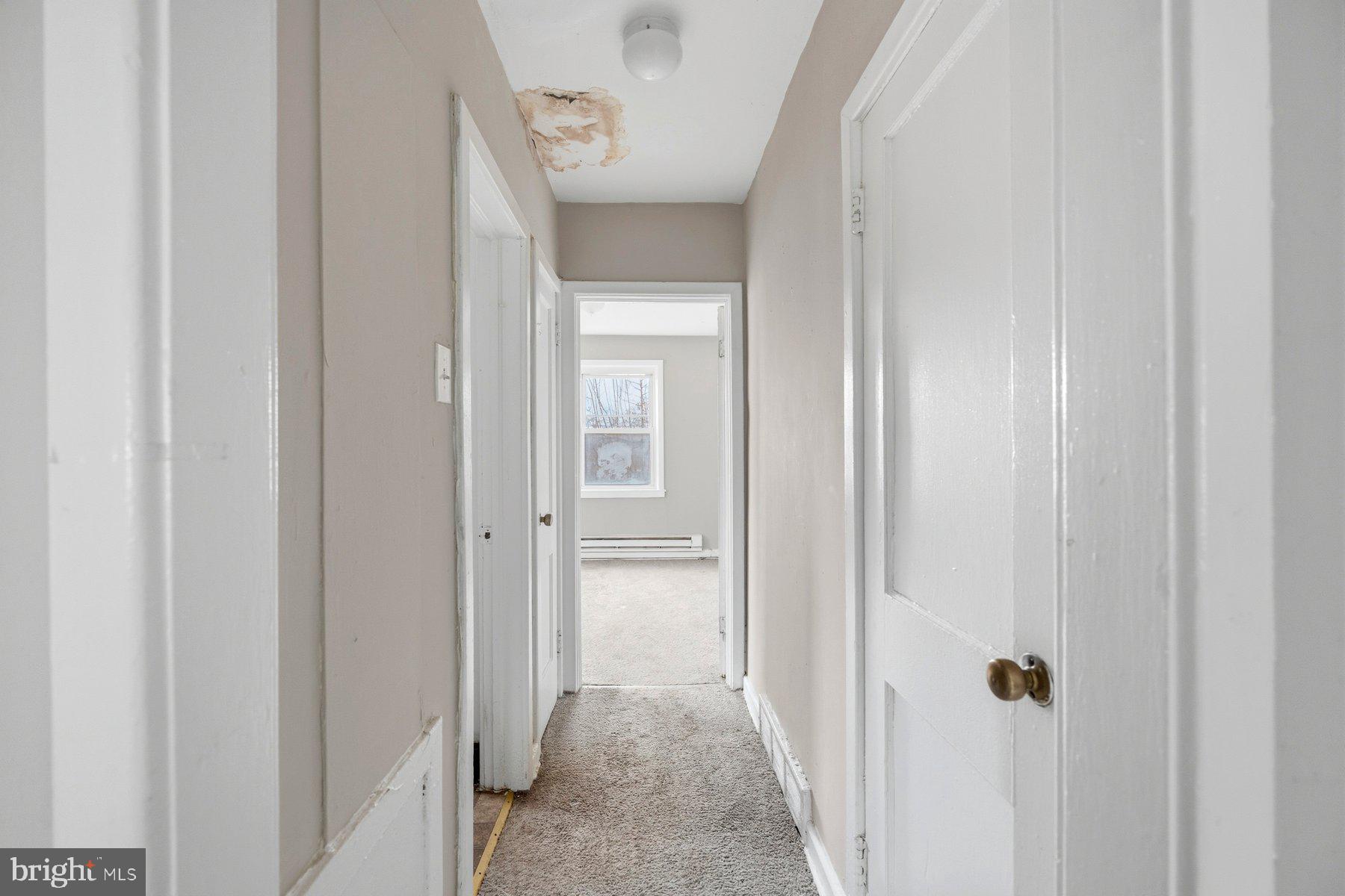 923 1st Street Baltimore, MD 21225 - Photo 26 of 32 a view of a hallway with wooden floor