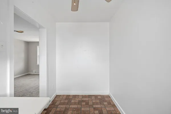 a utility room with cabinets washer and dryer