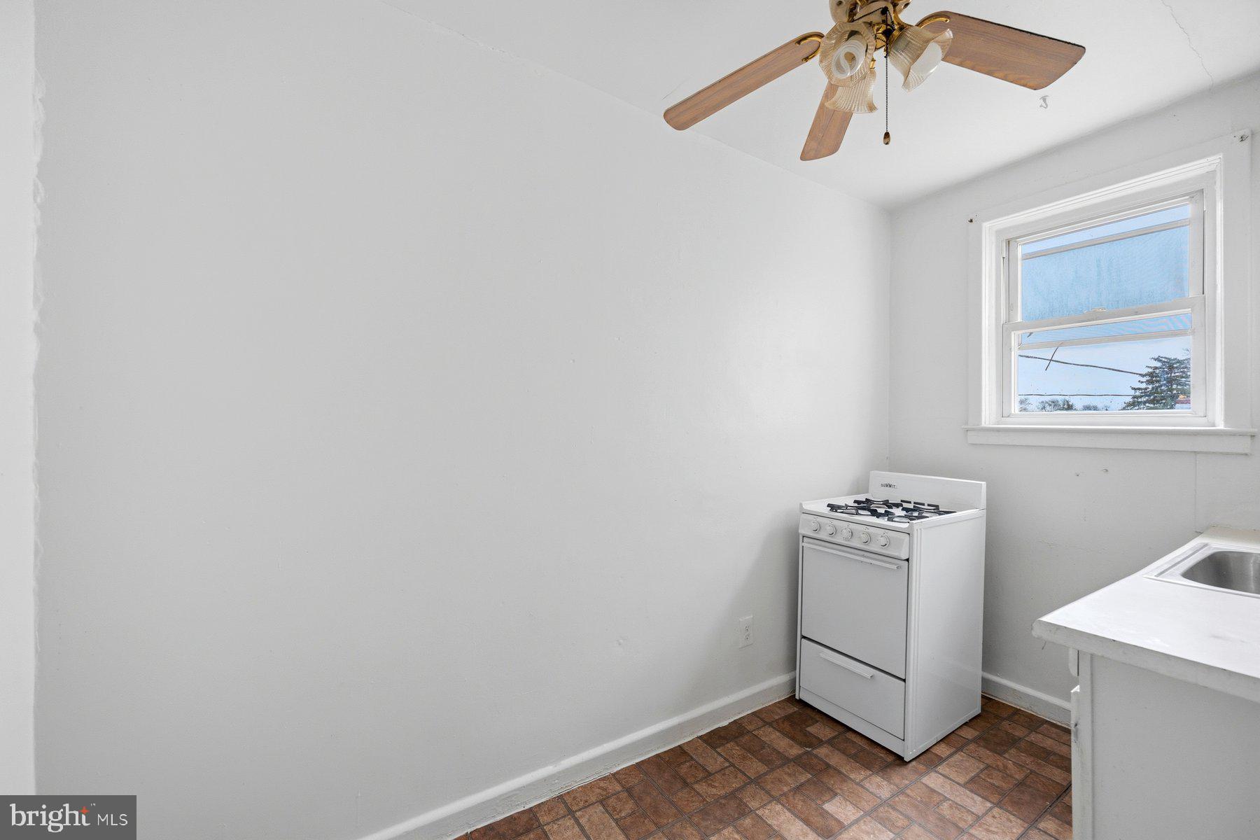 923 1st Street Baltimore, MD 21225 - Photo 28 of 32 a view of room with window and wooden floor