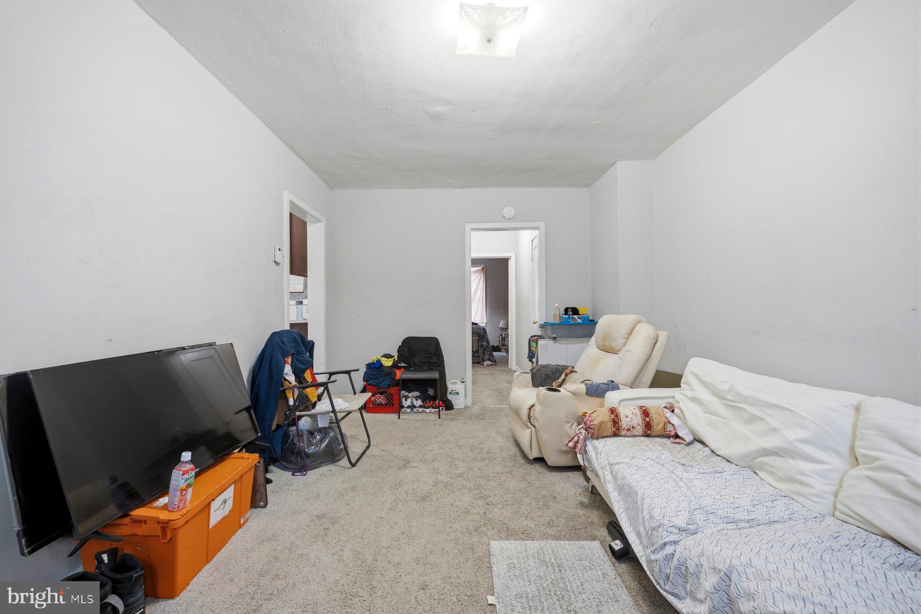 923 1st Street Baltimore, MD 21225 - Photo 4 of 32 a living room with furniture and a flat screen tv