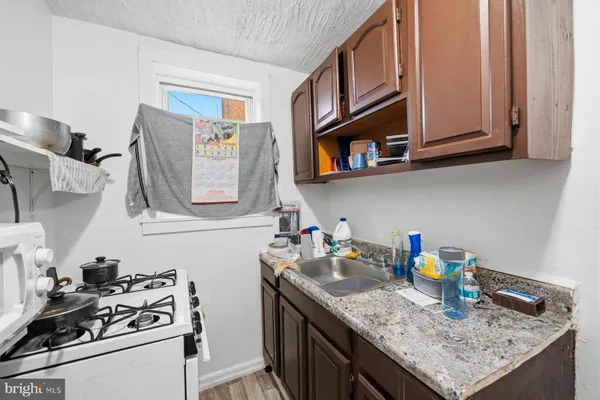 a bedroom with a bed and windows