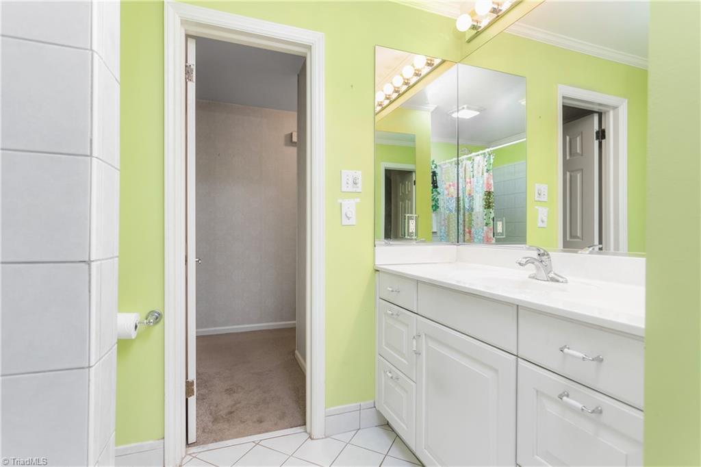 5306 Mockingbird Road Greensboro, NC 27406 - Photo 14 of 26 Upper hall bathroom with updated vanity and tub/shower.