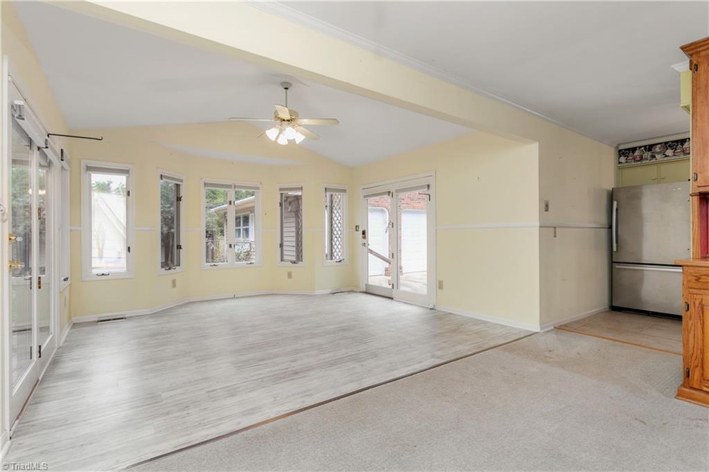 5306 Mockingbird Road Greensboro, NC 27406 - Photo 6 of 26 "Virtually staged" sun-filled space! Perfect for a dining area or sitting room! Access to Deck and garage.