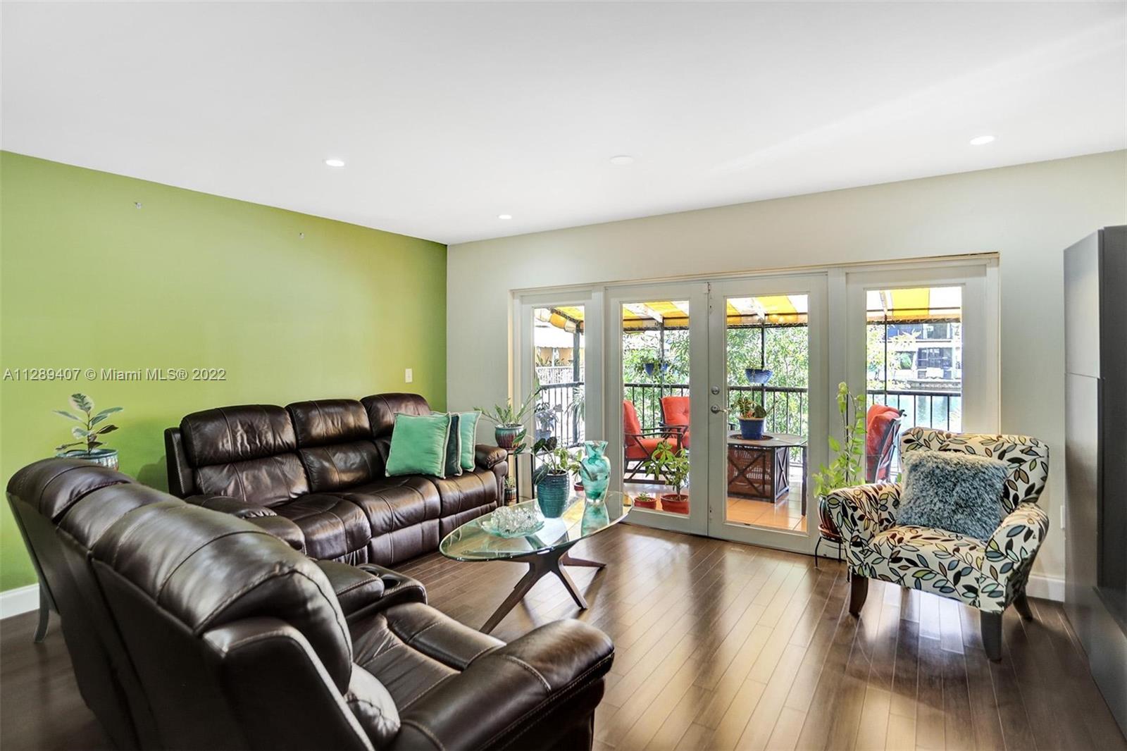 16511 Bridge End Road Miami Lakes, FL 33014 - Photo 12 of 43 a living room with furniture and a large window