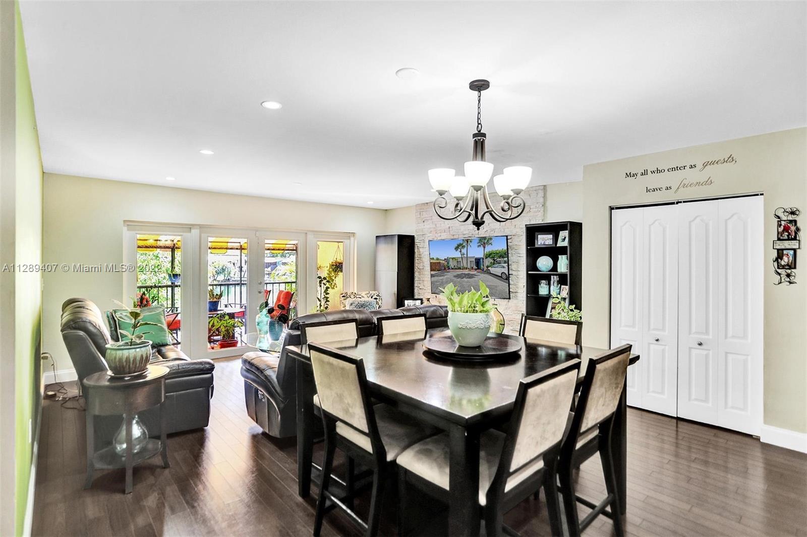 16511 Bridge End Road Miami Lakes, FL 33014 - Photo 13 of 43 a view of a dining room with furniture window and wooden floor