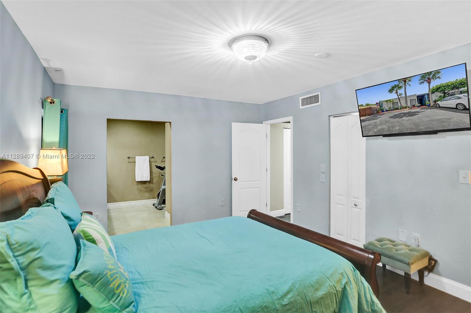 16511 Bridge End Road Miami Lakes, FL 33014 - Photo 22 of 43 a bedroom with a bed and a couch