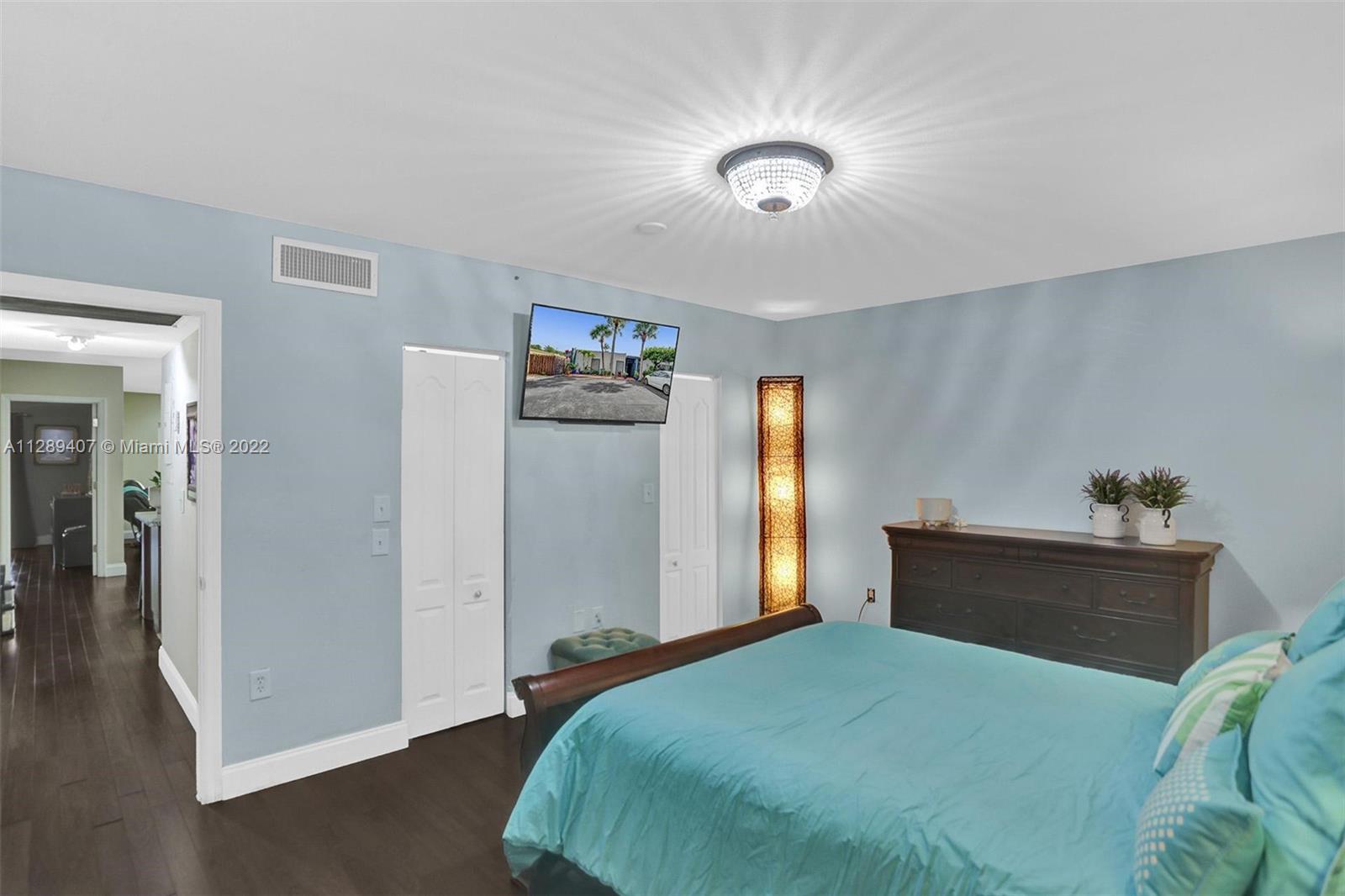16511 Bridge End Road Miami Lakes, FL 33014 - Photo 23 of 43 a bedroom with a bed and a window