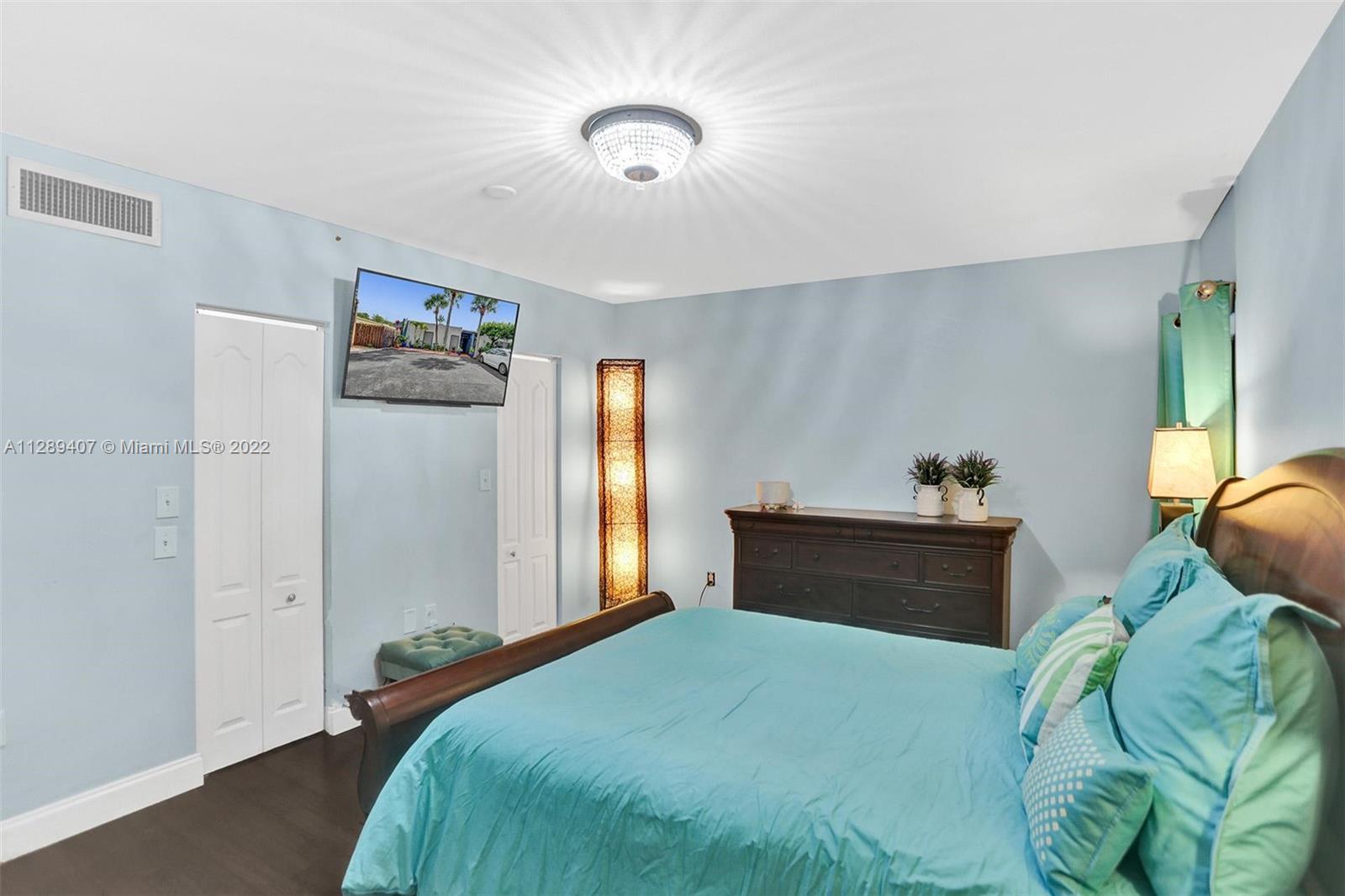 16511 Bridge End Road Miami Lakes, FL 33014 - Photo 24 of 43 a bedroom with a bed and a window