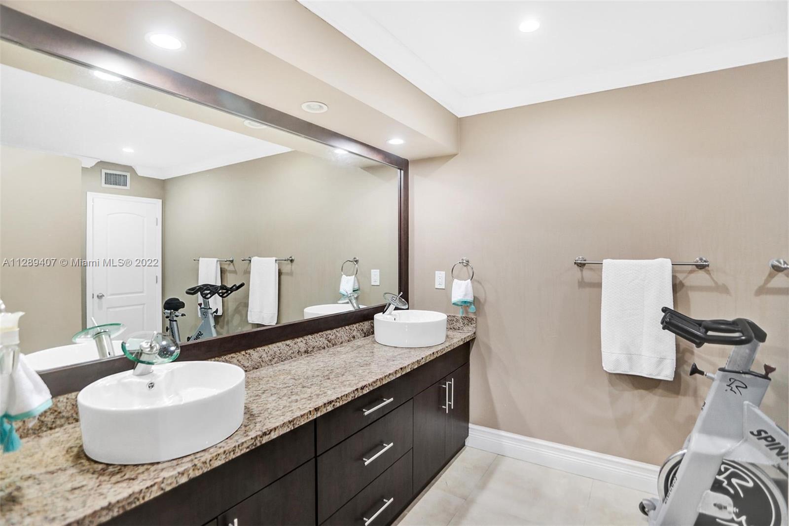 16511 Bridge End Road Miami Lakes, FL 33014 - Photo 27 of 43 a bathroom with a granite countertop sink and a mirror