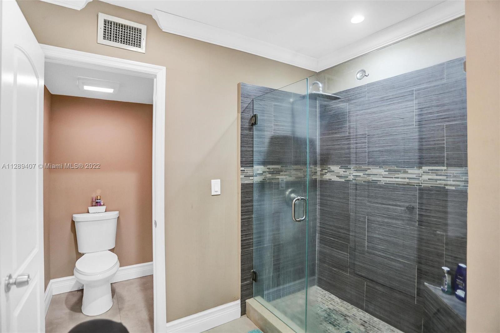 16511 Bridge End Road Miami Lakes, FL 33014 - Photo 29 of 43 a bathroom with a shower and toilet
