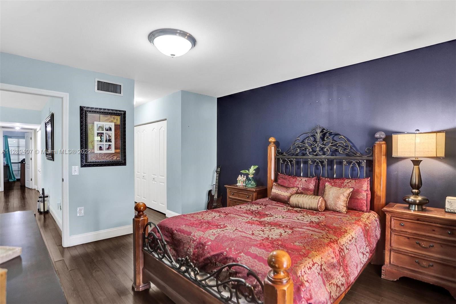 16511 Bridge End Road Miami Lakes, FL 33014 - Photo 31 of 43 a bedroom with a bed and wooden floor