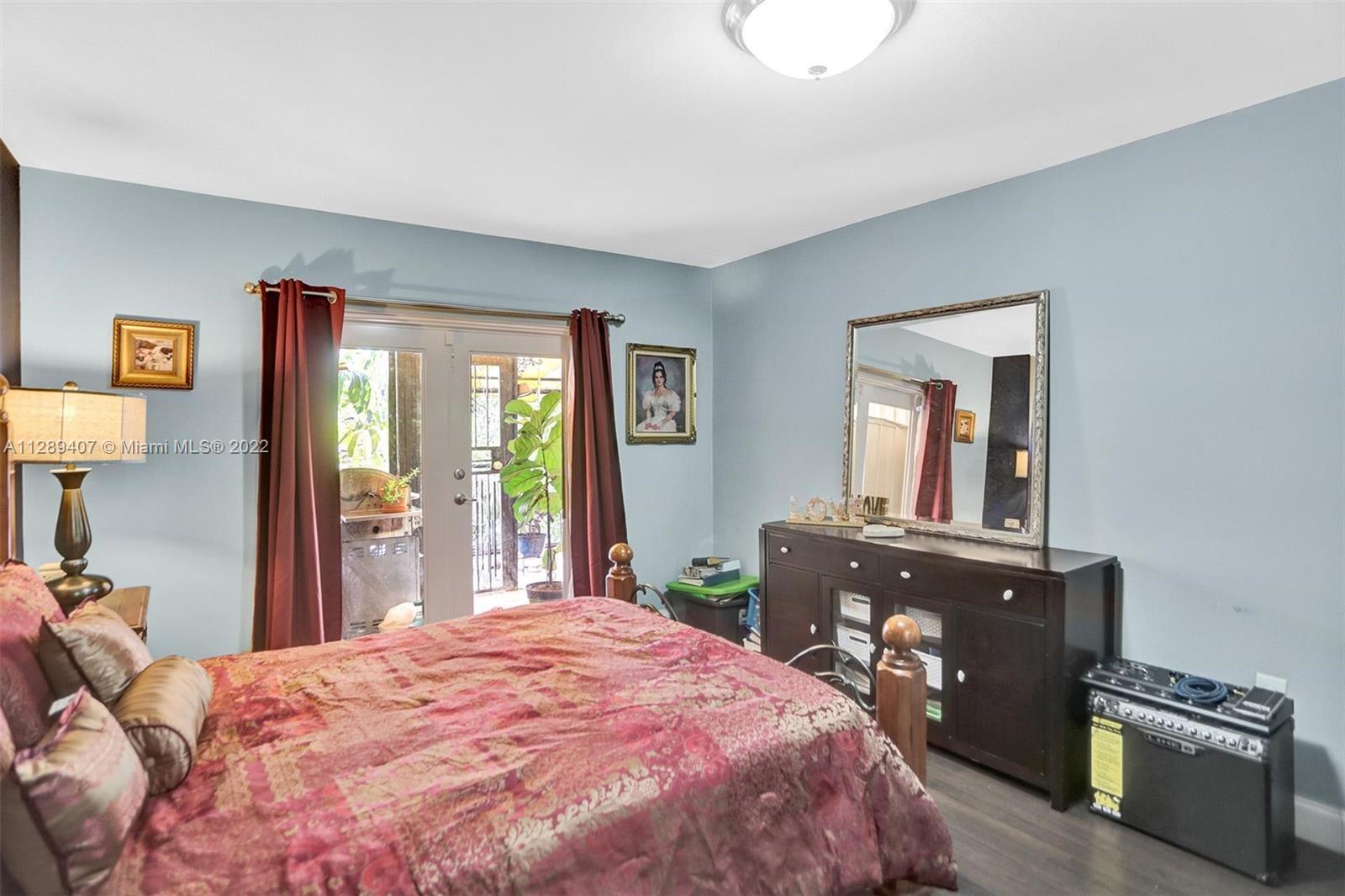 16511 Bridge End Road Miami Lakes, FL 33014 - Photo 32 of 43 a bedroom with a bed and a dresser