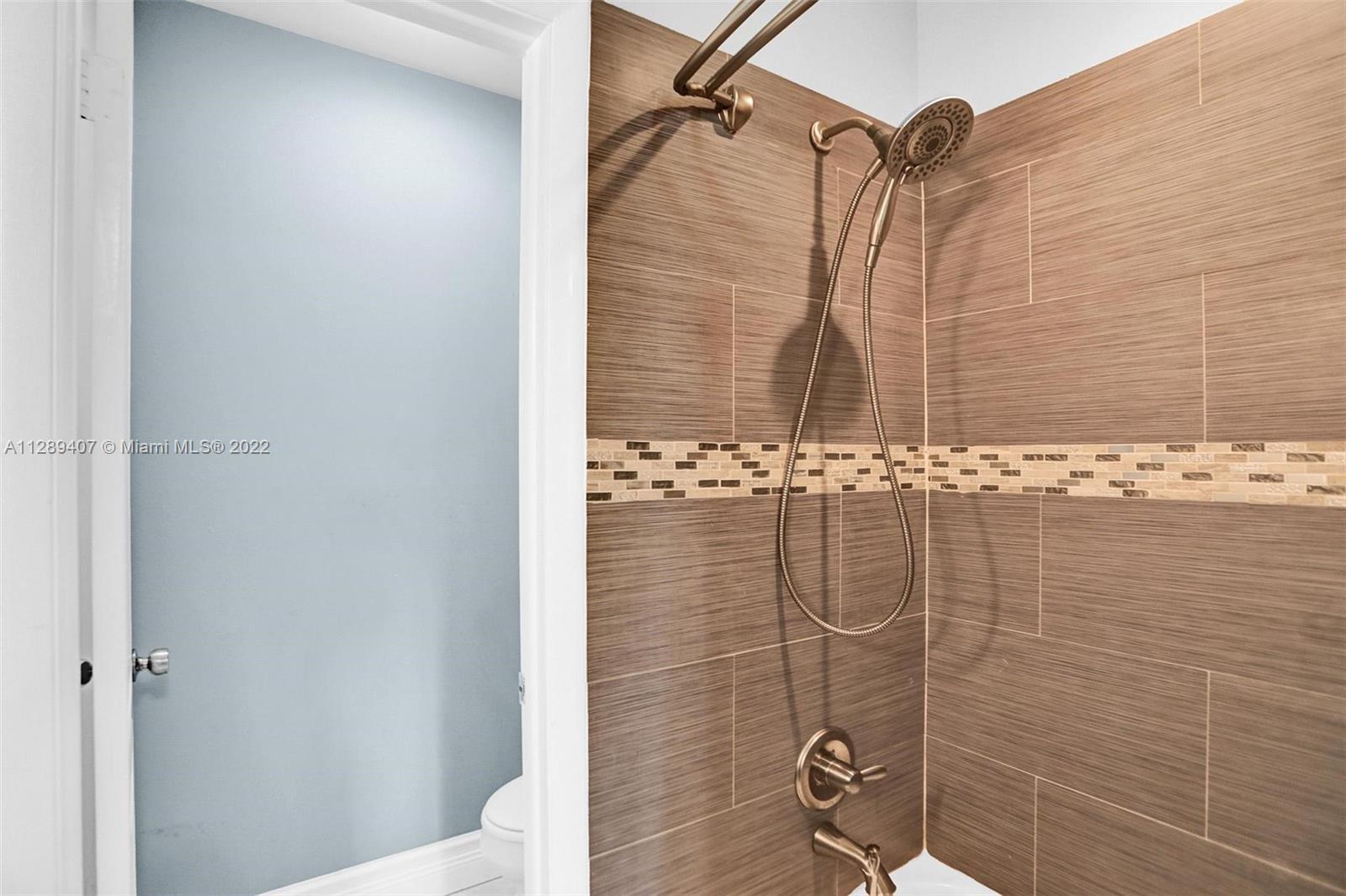 16511 Bridge End Road Miami Lakes, FL 33014 - Photo 35 of 43 a bathroom with a shower