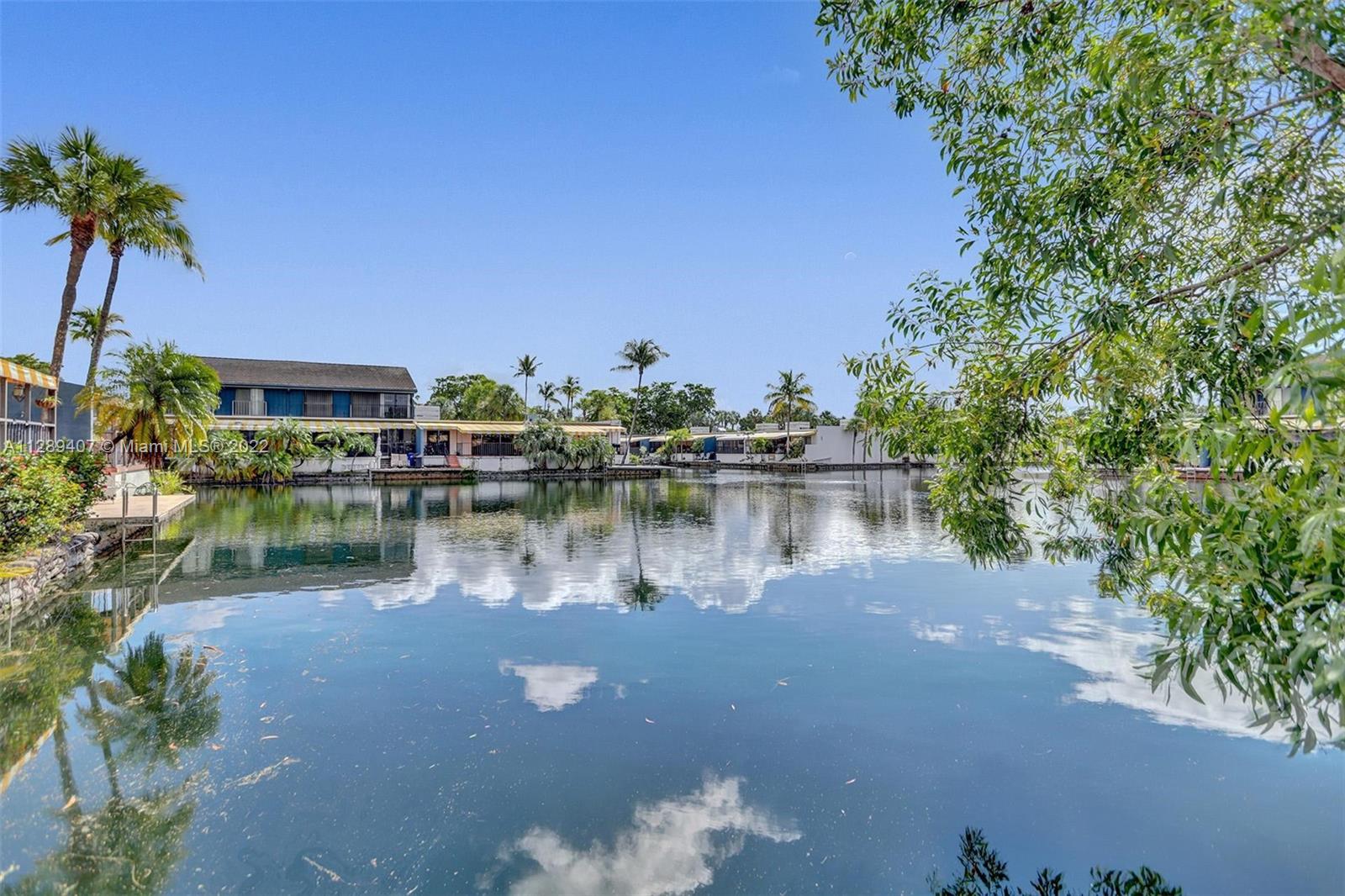 16511 Bridge End Road Miami Lakes, FL 33014 - Photo 40 of 43 a view of a lake with houses