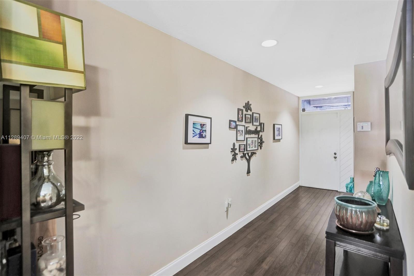 16511 Bridge End Road Miami Lakes, FL 33014 - Photo 5 of 43 a room with furniture and wooden floor