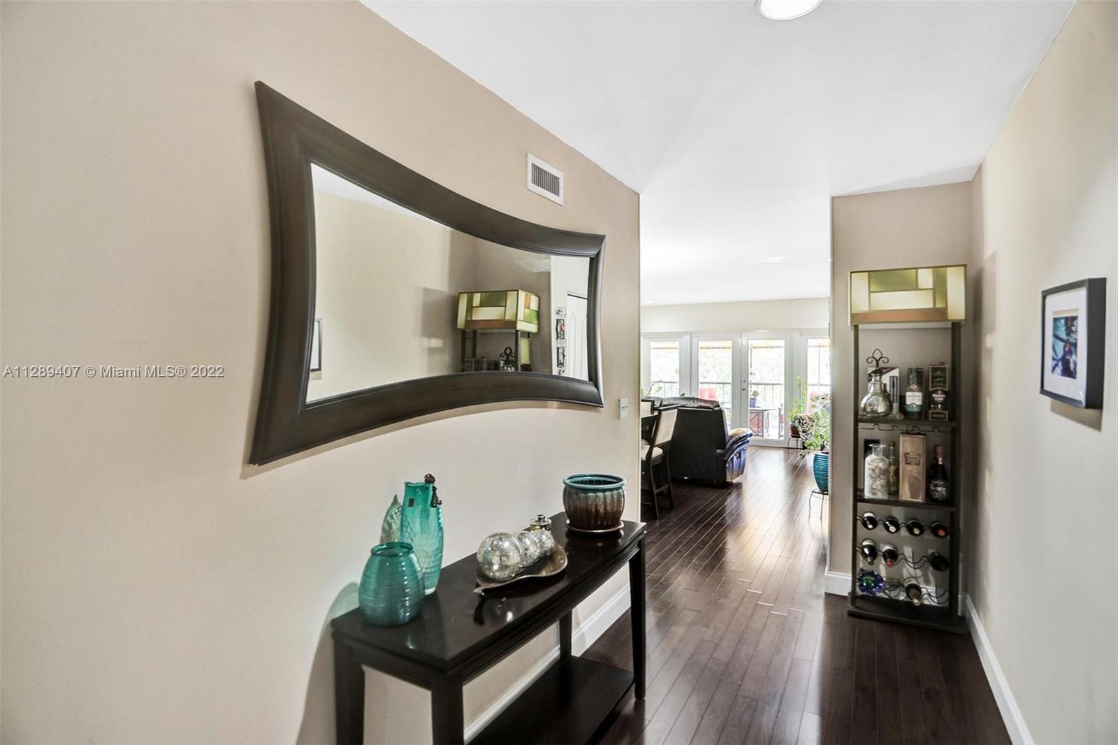 16511 Bridge End Road Miami Lakes, FL 33014 - Photo 7 of 43 a living room with furniture and a wooden floor