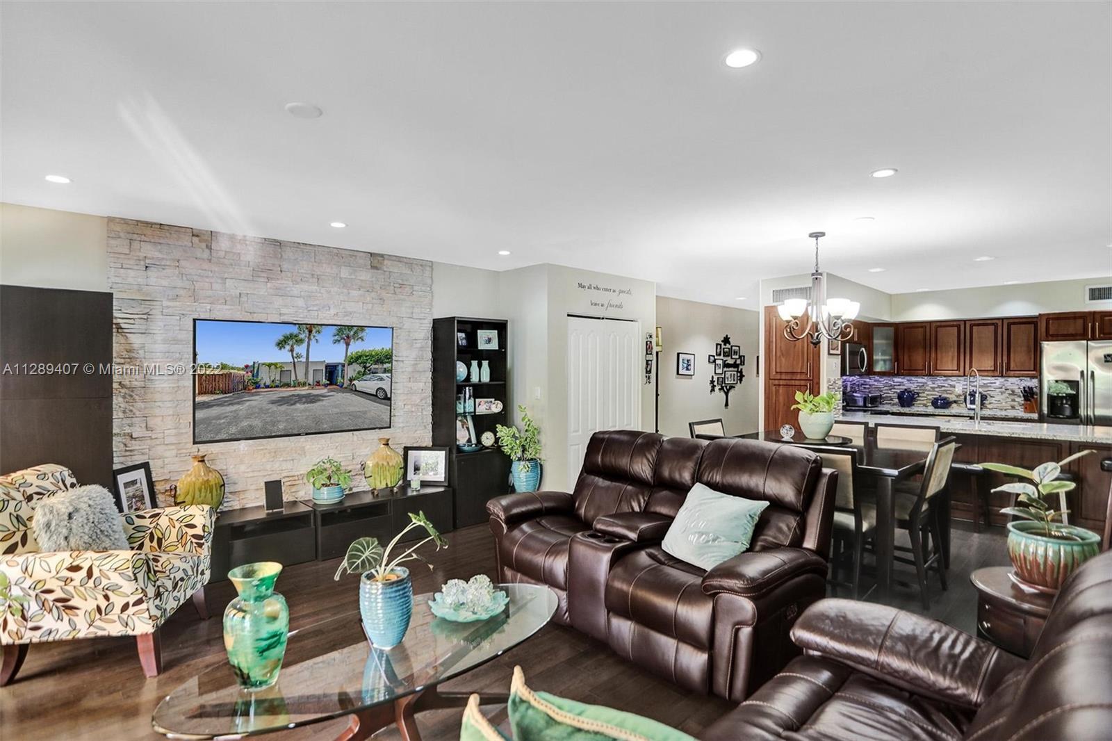 16511 Bridge End Road Miami Lakes, FL 33014 - Photo 8 of 43 a living room with furniture and kitchen view