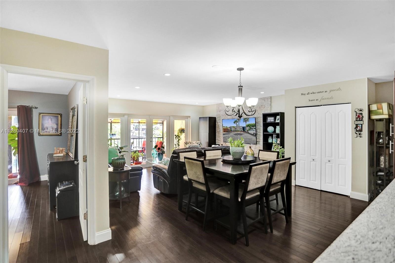 16511 Bridge End Road Miami Lakes, FL 33014 - Photo 10 of 43 a view of a dining room with furniture window and wooden floor