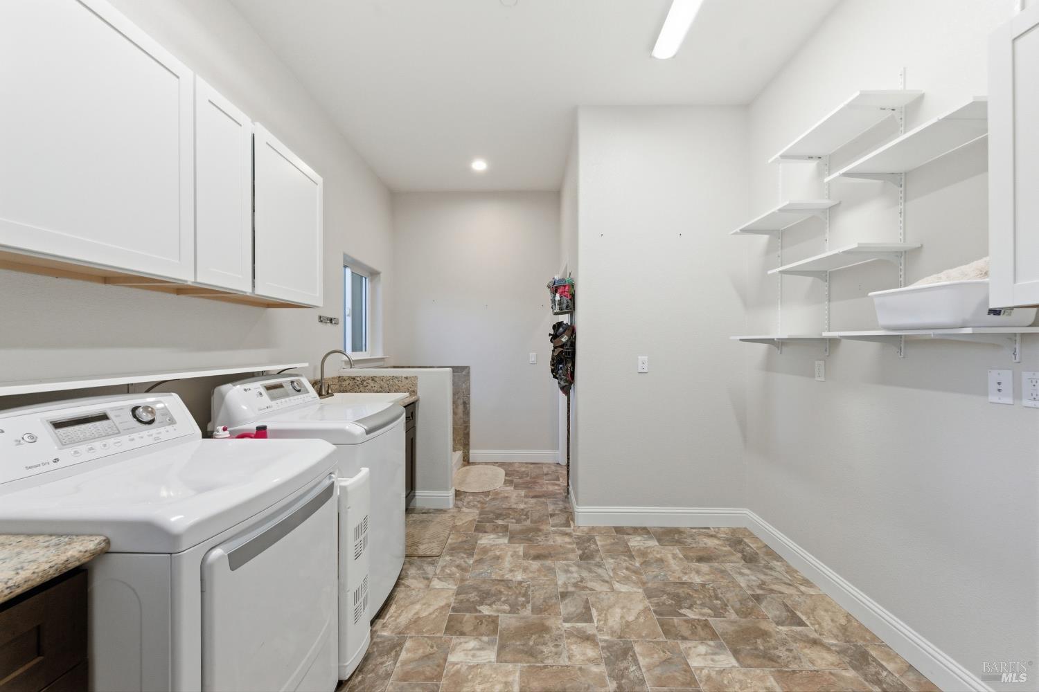 7561 Pleasants Valley Road Vacaville, CA 95688 - Photo 15 of 44 Huge laundry room with lots of storage.