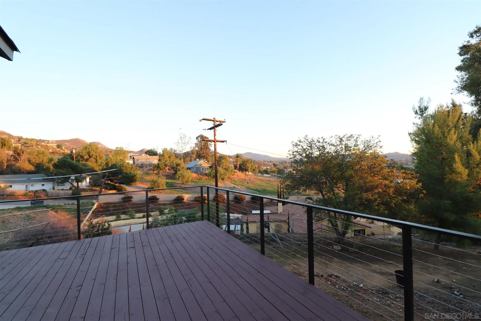 2030 Valley Rim Road El Cajon, CA 92019 - Photo 5 of 75 a view of a balcony with wooden floor and lake view