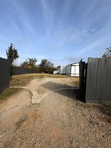 a view of a street with an ocean view