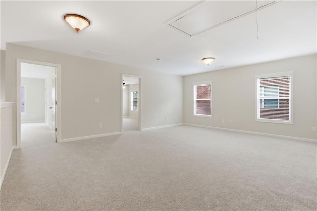 1515 Riva Ridge Suwanee, GA 30024 - Photo 21 of 35 a view of an empty room with a window