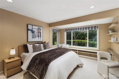 a bedroom with a bed and a lamp